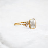 silent-luster-emerald-cluster-bezel-moissanite-engagement-ring-1-ct-yellow-gold-gemfora-2